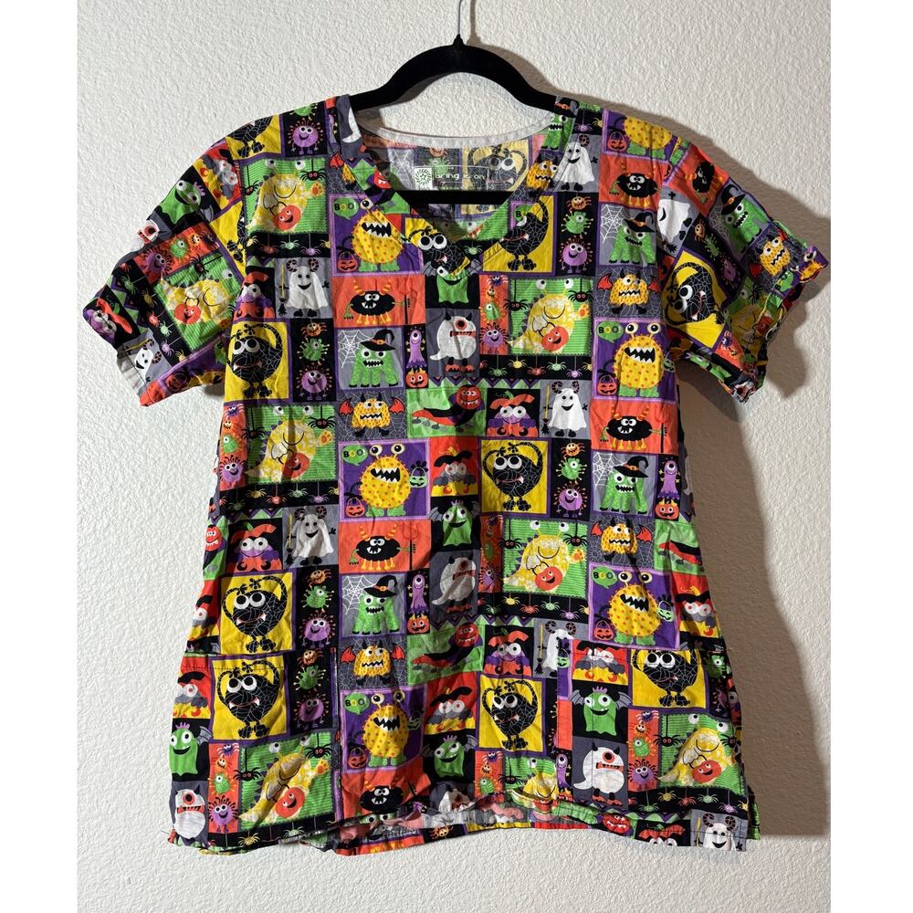 Bio Bring It On Women's Size M Halloween V-Neck Scrub Top Ghosts Monsters